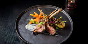 Char-grilled lamb rack with honey carrots,brussels sprouts and sweet miso mint sauce.
