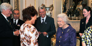 Queen Elizabeth II was impressed by the corgi-in-a-crown outfit worn by Kathy Lette during a royal reception Australians living in the UK in 2011.