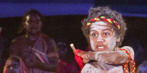 A boy performs with the Red Flag Dancers,a group from the Arnhem Land community of Numbulwarr.