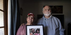 Kim May with her brother,Kenny,holding a photo of their late mother and father. They have serious concerns about the treatment of their mother,Gwendoline May,in a NSW hospital. 