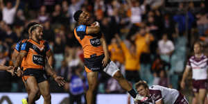 Latu Fainu celebrates a try against Manly.