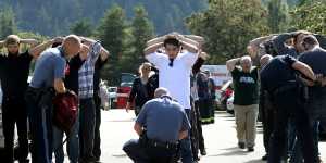 Police search students outside Umpqua Community College in Roseburg,Oregon.