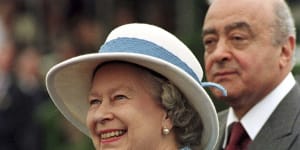 Queen Elizabeth II accompanied by the then owner of Harrods,Mohamed Al Fayed,at the 1997 Royal Windsor Horse Show.