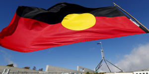 The Aboriginal flag flies near Parliament House in Canberra.
