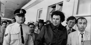 Greek composer Mikis Theodorakis (centre) at Sydney Airport in 1972,the year he appeared at the Adelaide Festival.