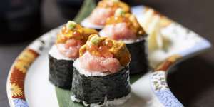 Boom roll piled high with tuna belly,creamy sea urchin and salmon roe.