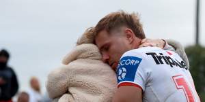 Jack De Belin reacts with his family after playing against Western Suburbs at Lidcombe Oval on his return to the game.