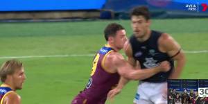 Carlton’s George Hewitt and Brisbane’s Lachie Neale clash at the Gabba.