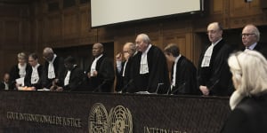 Judges Israel’s Aharon Barak,centre right,and South Africa’s Dikgang Ernest Moseneke,centre left,preside over the opening of the hearings at the International Court of Justice.