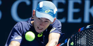 Winning start:De Minaur beat Austria's Gerald Melzer in five sets on day one at the Australian Open.