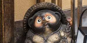 A lucky tanuki statue pictured outside a Kyoto restaurant.