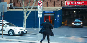 Mohammed Ali sprinting from the Downing Centre District Court.