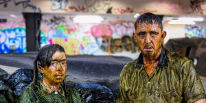 Down and dirty:Angus Cerini and Nicci Wilks perform part of THIS in a pool of mud.