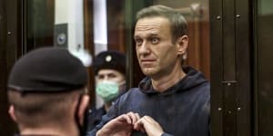 Russian opposition figure Alexei Navalny sends a heart message to his wife Yulia while in a Russian court in early 2021. He was sentenced to more than 11 years in prison after returning to Russia. 