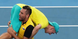 Nick Kyrgios carrying Alex de Minaur after the win over Great Britain at the ATP Cup in 2020.