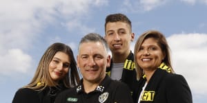 Richmond coach Adem Yze with his children Jasmine and Noah,and wife Afijet.