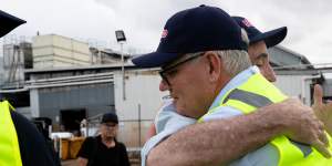 Former prime minister Scott Morrison got a hug at the end of his factory tour in South Lismore,March 9,2022. 