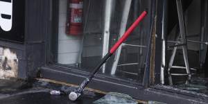 A sledgehammer and a small purple blowtorch rest at the scene of a break-in and arson attack in Collingwood.