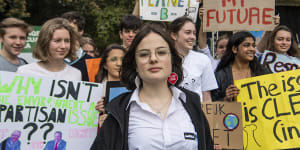 'We will never back down':80,000 strike in Sydney over climate change