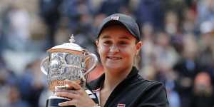 Jubilant:Australia's Ashleigh Barty holds the trophy. 