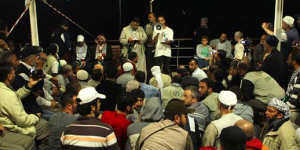 A crowd gathers for a meeting at the stern of the MV Marmara passenger boat,part of the Free Gaza flotilla.