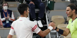 Novak Djokovic and Rafael Nadal shake hands after their semi-final at Roland-Garros last year.