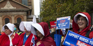 Wyong Hospital nurses came to the Sydney rally dressed as handmaids from the Margaret Atwood novel.