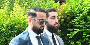 Lawyers arrive at the Bankstown home of Ahmad Rashad Nadir.