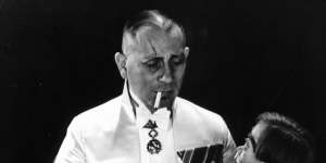 Erich von Stroheim holding the wooden dummy in a scene from the 1929 film The Great Gabbo.