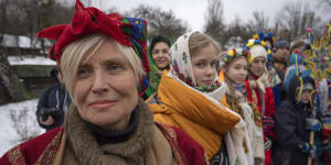 People dressed in national costume celebrate Christmas in the village of Pirogovo outside capital Kyiv,Ukraine.