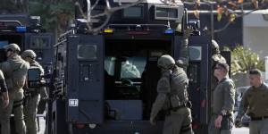 SWAT officers surround a van,suspected to belong to the shooter in Torrance in California.