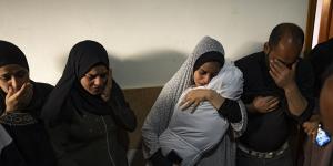 Members of the Abu Draz family mourn their relatives killed in the Israeli bombardment of the Gaza Strip,at their house in Rafah.