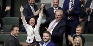 Liberal MP Gladys Liu is congratulated by Prime Minister Scott Morrison after delivering her first speech in the House of Representatives in July 2019.