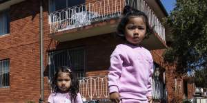 Saira Gurung playing with her cousin Sharon Shrestha out the front of an apartment block on Evaline street,Campsie.