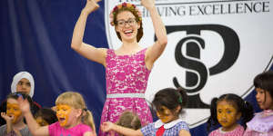 Emma Watkins using sign language at a visit to the Thomas Pattison Deaf School. 