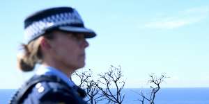 Police undertake a search at North Head near Manly on Tuesday following an arrest.