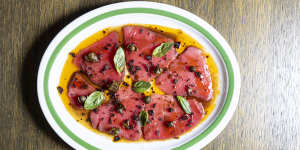 Tuna carpaccio with tomato,olive crumb and capers. 