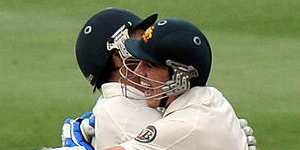 Australian cricketers Mitchell Johnson (left) and Patrick Cummins celebrate victory in the second Test against South Africa at Johannesburg.
