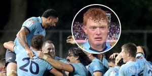 The Waratahs celebrate their win,while Tane Edmed gets emotional after the siren. 