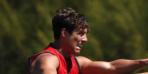 Former Giants midfielder Jye Caldwell lets fly during an Essendon training session.