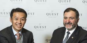 Quest's Paul Constantinou shaking hands with Ascott's Lee Chee Koon after the sale of Quest.