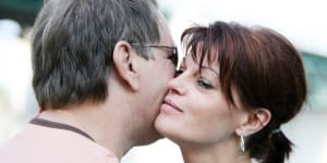Should I let my girlfriend’s husband kiss me on the lips?
