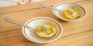 "Pasta on a spoon"might be a singular duck raviolo with mandarin butter.