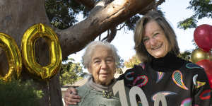 Kumari Pease (right) and Joan Couzoff celebrate their favourite tree’s centenary.