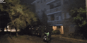 The line of police move in to make the arrest.