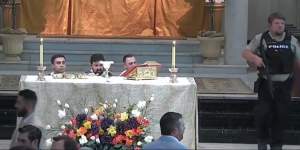 Clergy react during the incident in the Louisiana church.