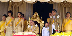 The late king is flanked by his family,including then Crown Prince Maha Vajiralongkorn,second from right,and Princess Maha Chakri Sirindhorn,first right,in December 2012.