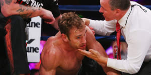 Shane Tuck on the ground after being knocked out during a boxing match after his retirement from AFL.