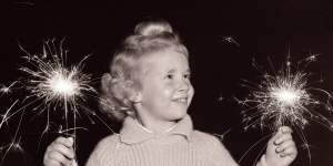 Yvonne Chladell of Bellevue Hill with sparklers on Bonfire night,Waverley,24 May 1963
