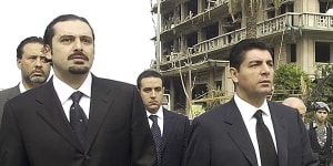 Bahaa Hariri,right,and Saad Hariri,sons of Lebanese prime minister Rafik Hariri,visit the scene where their father was assassinated in Beirut in 2005.